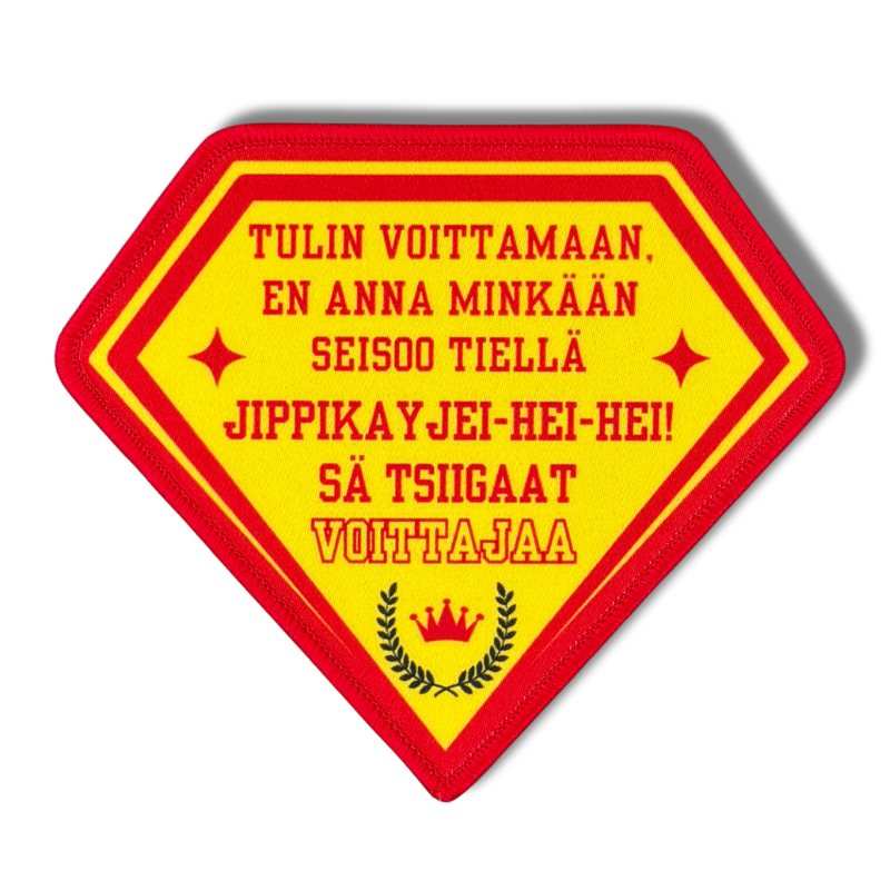 Printattu haalarimerkki saumatulla reunalla, tekstillä: ''Tulin voittamaan, en anna minkään seisoo tiellä''