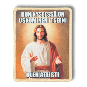 Printattu haalarimerkki jeesuksesta saumatulla reunalla ja tekstillä: ''Kun kyseessä on uskominen itseeni, olen ateisti''