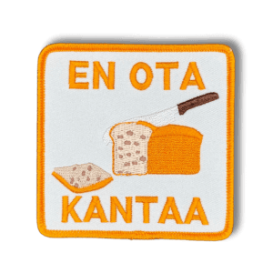 Brodeerattu haalarimerkki leivästä saumatulla reunalla, tekstillä: ''En ota kantaa''